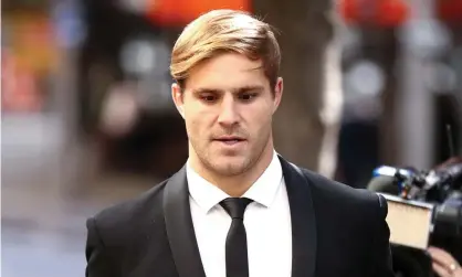  ?? Photograph: Brendon Thorne/AAP ?? NRL player Jack de Belin arrives at Downing Centre district court in Sydney on Wednesday. The footballer and his friend, Callan Sinclair, have pleaded not guilty to aggravated sexual assault.