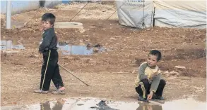  ??  ?? STRUGGLE
Syrian children at the huge refugee camp in Zaatari, Jordan