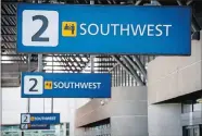  ?? DAVID PAUL MORRIS/BLOOMBERG ?? Southwest Airlines signs at Oakland Internatio­nal Airport in Oakland, Calif.