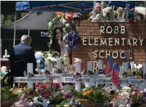  ?? ?? Texas Gov. Greg Abbott visits a memorial at Robb Elementary School in Uvalde, Texas, Sunday, May 29, 2022, to pay his respects to the victims killed in a school shooting.