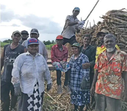  ?? Photo: Laisa Lui ?? The cane cutters with Nirmala Wati (sitting) while loading the cane at Solove, Wailevu on June 23, 2020.