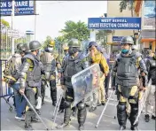  ?? ?? Police stands vigil outside EC office, during a protest against the alleged rigging during Kolkata civic polls, on Monday.