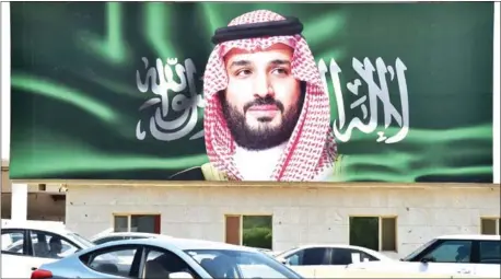  ?? FAYEZ NURELDINE/AFP ?? A portrait of Saudi Crown Prince Mohammed bin Salman is displayed in the capital Riyadh on Monday, one day ahead of the the Future Investment Initiative conference.