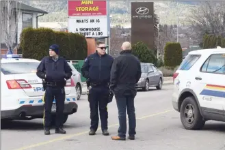  ?? MELANIE EKSAL/Penticton Herald ?? Police block a road Thursday morning outside Penticton Hyundai, one of three auto dealers in Penticton that were evacuated after a bomb threat.