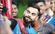  ??  ?? Indian cricket captain Virat Kohli poses for photo with his supporters after a training session ahead of the India-Australia cricket series in Chennai on
Sept 15. (AFP)