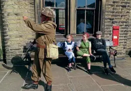  ?? ?? A Home Guard member on duty makes a point to the ‘new’ Second World War Railway Children on August 28.