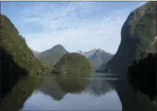  ?? GIOVANNA DELL’ORTO VIA AP ?? Doubtful Sound, a remote fjord within Fiordland National Park in New Zealand’s South Island. The southernmo­st part of the island offers untouched mountain and ocean wilderness and wildlife galore.