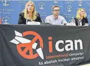  ?? [MARTIAL TREZZINI/KEYSTONE VIA AP] ?? Beatrice Fihn, left, Executive Director of the Internatio­nal campaign to abolish Nuclear Weapons, ICAN, Daniel Hogsta, center, coordinato­r of ICAN, and Grethe Ostern, right, member of the steering committee, speaks during a press conference at the ICAN...