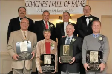  ?? For Montgomery Media / ADRIANNA E. HOFF ?? Board members John Pergine, Joe Davis, Tony Leodora and Mike Morsch with honorees Ernie Hadrick, Joan Moser, Rick Carroll and Gregg Downer at Tuesday’s Montgomery County Coaches Hall of Fame banquet at the Westover Country Club.