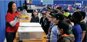  ?? ?? Jackie Wiebe from the Little Bitty Ranch explains egg incubation to Grade 3 students from All Saints Catholic School at Discover the Farm, April 28.