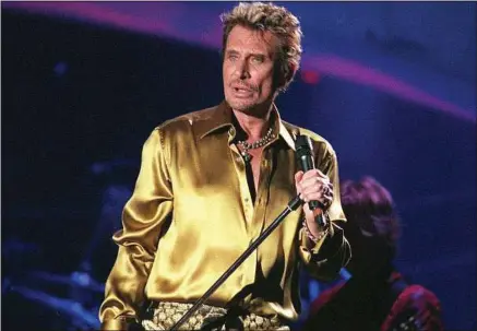  ??  ?? Johnny le 10 juin 2000, lors du concert gratuit au pied de la tour Eiffel qui célèbre ses quarante ans de carrière.