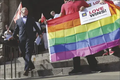  ?? AP PHOTO/ERIC GAY ?? Jim Obergefell, the named plaintiff in the Obergefell v. Hodges Supreme Court case that legalized same sex marriage nationwide, arrives for a news conference on the steps of the Texas Capitol, June 29, 2015, in Austin, Texas.