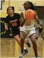  ?? (Pine Bluff Commercial/I.C. Murrell) ?? Trinity Mitchner of Watson Chapel handles the ball as Kynnedi Barnett of White Hall defends against her in the first half.