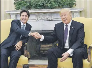  ?? AP PHOTO ?? Prime Minister Justin Trudeau meets with U.S. President Donald Trump in the Oval Office of the White House, in Washington, D.C., on Feb. 13. In the face of new pressure from the U.S., Trudeau is defending Canada’s defence spending.