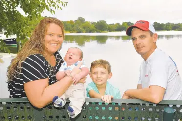  ?? PAULW. GILLESPIE/CAPITAL GAZETTE ?? Jessica Passwaters, Waylon James Vickers, 10 days old, Cru Vickers, 4, and Brad Vickers relax. At 13.02 pounds and 22 inches, Waylon is one of the biggest babies ever delivered at Anne Arundel Medical Center.