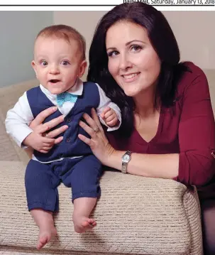  ??  ?? Look at me now: The infant aged one with his proud mum Lisa Curtis