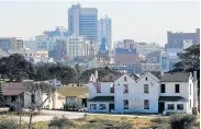  ?? Picture: WERNER HILLS ?? DAYS NUMBERED: The derelict historic houses owned by Transnet across the road from the South End Museum