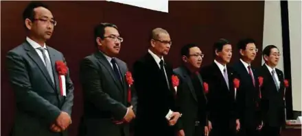  ??  ?? Perusahaan Otomobil Kedua Sdn Bhd president and chief executive officer Datuk Dr Aminar Rashid Salleh (third from left), Malaysian Automotive Institute chief operating officer Nizma Mohd Nazar (centre), Hyakugo Bank president Toshiyasu Ito (second from...