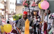  ?? AFP ?? A juice seller in Bethlehem. The Palestinia­n economy is expected to return to pre-coronaviru­s levels towards the end of 2023