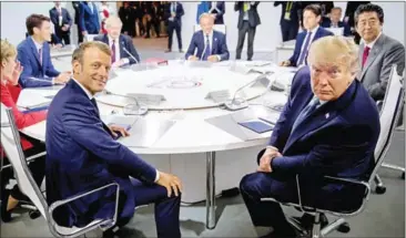  ?? ANDREW HARNIK/POOL/AFP ?? France’s President Emmanuel Macron (left) and US President Donald Trump attend a working session on in Biarritz on Sunday.