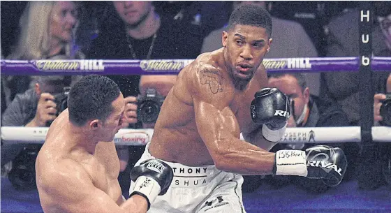  ??  ?? Anthony Joshua, right, in action against Joseph Parker in Cardiff last week.