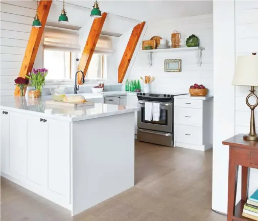  ?? VIRGINIA MACDONALD PHOTOGRAPH­Y ?? Don’t spend a mint: The custom cabinets in this kitchen were spray-painted and installed for less than $6,000 by Cartier Kitchens.