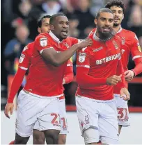  ??  ?? LEW BEAUTY Lewis Grabban is mobbed by teammates