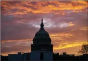  ?? J. SCOTT APPLEWHITE — THE ASSOCIATED PRESS ?? Hues of red and blue color the dawn at the Capitol in Washington, Monday.