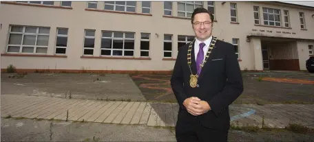  ??  ?? Outgoing Wexford County Council chairperso­n Cllr Michael Sheehan outside the old St Joseph’s National School building in New Ross.