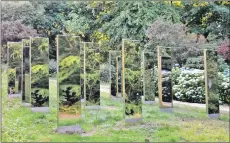  ??  ?? An array of 21 reflective pillars, influenced by the Machrie Moor standing stones.