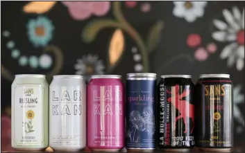  ?? RAMIN RAHIMIAN — THE NEW YORK TIMES ?? Canned wines at La Calenda restaurant in Yountville, Calif., on May 2, 2019. A new report finds that wine in cans is one way the American wine industry should court younger consumers.