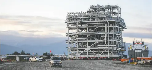  ?? LNG CANADA VIA REUTERS ?? An LNG Canada module is delivered in September by ship to dockside at the Kitimat, B.C. constructi­on site