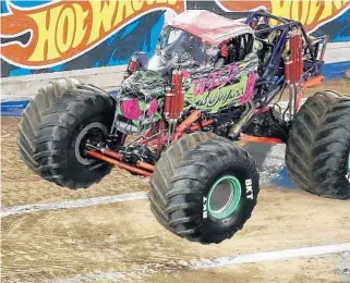  ?? STEPHEN M. DOWELL/ORLANDO SENTINEL ?? Wild Flower jumps during Monster Jam at Camping World Stadium in January. Orlando is a regular stop on the monster-truck tour and has been selected to host the world championsh­ips, formerly in Las Vegas.