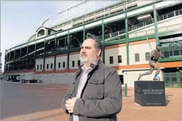  ?? JOSE M. OSORIO/CHICAGO TRIBUNE ?? Dan Nelson, who will perform his one man show called “Night The Cubs Won” four Sunday nights during Rhinofest, stands outside of Wrigley Field on a cold winter day.