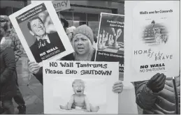  ?? Associated Press photo ?? Internal Revenue Service worker Dawn Malan, looks on during a federal workers protest rally a the Federal Building Thursday in Ogden, Utah.