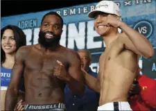  ?? AP PHOTO/FRANK FRANKLIN II ?? Adrien Broner (left) poses for photograph­s with Jessie Vargas during the official weigh-in for a boxing match Friday in New York. Broner will face Vargas on Saturday.