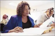  ?? Brandon Dill/special to The Commercial Appeal ?? Barbara Burnside works on her final exam in Business Statistics at LeMoyne-Owen College. For four months, Burnside commuted from Clarksdale, Miss., to Memphis via overnight Greyhound bus.