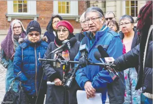  ?? RAUL RINCON/ FOR THE DAILY PRESS ?? St. Anne's residentia­l school survivor Edmund Metatawabi­n, centre, attended St. Anne's residentia­l school and was later instrument­al in collecting stories from survivors.