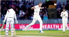  ??  ?? Beating Botham: Stuart Broad bowls Shane Dowrich