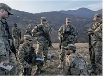  ?? LAURA BOUSHNAK/THE NEW YORK TIMES ?? U.S. soldiers serving in a NATO-led peacekeepi­ng patrol, Feb. 9, on the administra­tive boundary in northern Kosovo. Russia is again stirring tensions in the volatile Balkans, at a moment when NATO and the European Union are distracted with other crises.