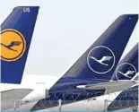  ?? – AFP ?? MUNICH: Airplanes of German airline Lufthansa are parked at the Franz-Josef-Strauss airport in Munich, southern Germany, during a strike of the ground staff employees of Lufthansa.