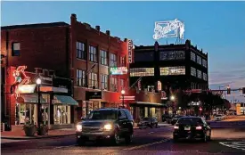  ?? [PHOTO BY DOUG HOKE, THE OKLAHOMAN] ?? Steve Mason’s first urban redevelopm­ent along the 1000 block of N Broadway is a vibrant gateway into Automobile Alley.