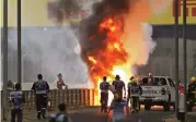  ?? (AFP) ?? Grosjean’s car erupts in flames after the collision in Sakhir, Bahrain