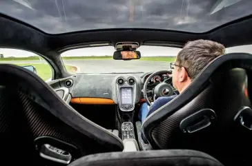  ??  ?? Above: glass roof can be adjusted for tint level. Below left: Sport Pack chassis really shines on track, but rear end can be tricky at the limit. Below right: carbon-ceramic brakes are now standard