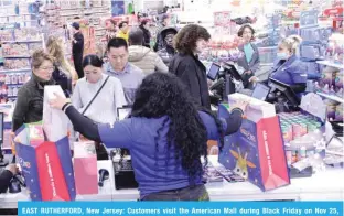  ?? —AFP ?? EAST RUTHERFORD, New Jersey: Customers visit the American Mall during Black Friday on Nov 25, 2022.