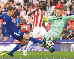  ??  ?? Chelsea striker Alvaro Morata (left) shoots past Stoke City goalkeeper Jack Butland to score his team’s fourth goal, his third, during Saturday’s English Premier League football at the bet365 Stadium in Stoke-on-Trent . – AFPPIX