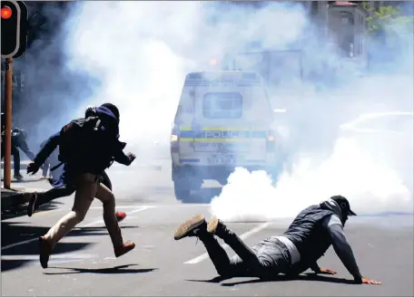  ?? Picture: Ayanda Ndamane/ANA ?? TENSE: Police use stun grenades at Cape Peninsula University of Technology students who were marching to Parliament to hand over a memorandum. Two students were arrested.