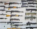  ?? AP ?? Federally licensed firearms dealers set a single- day record for background check requests to the FBI on Friday.