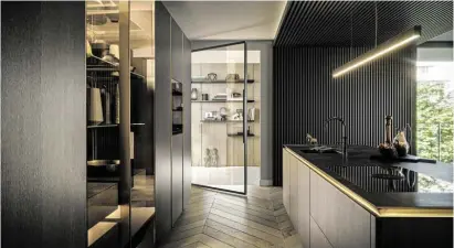  ??  ?? SLX Pure von SieMatic. Ein einmaliges Greiferleb­nis, die unglaublic­he Leichtigke­it und die besondere Ausstrahlu­ng machen die neue SieMatic SLX PURE zu einer besonderen Küche. Fronten in edlem Holz in Kombinatio­n mit broncierte­m Aluminium und feinster Keramikarb­eitsfläche.