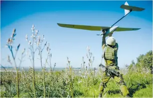  ??  ?? A SOLDIER launches a Skylark drone. (IDF Spokespers­on’s Unit)